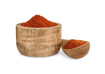 Photo of Bowl and spoon with aromatic paprika powder isolated on white