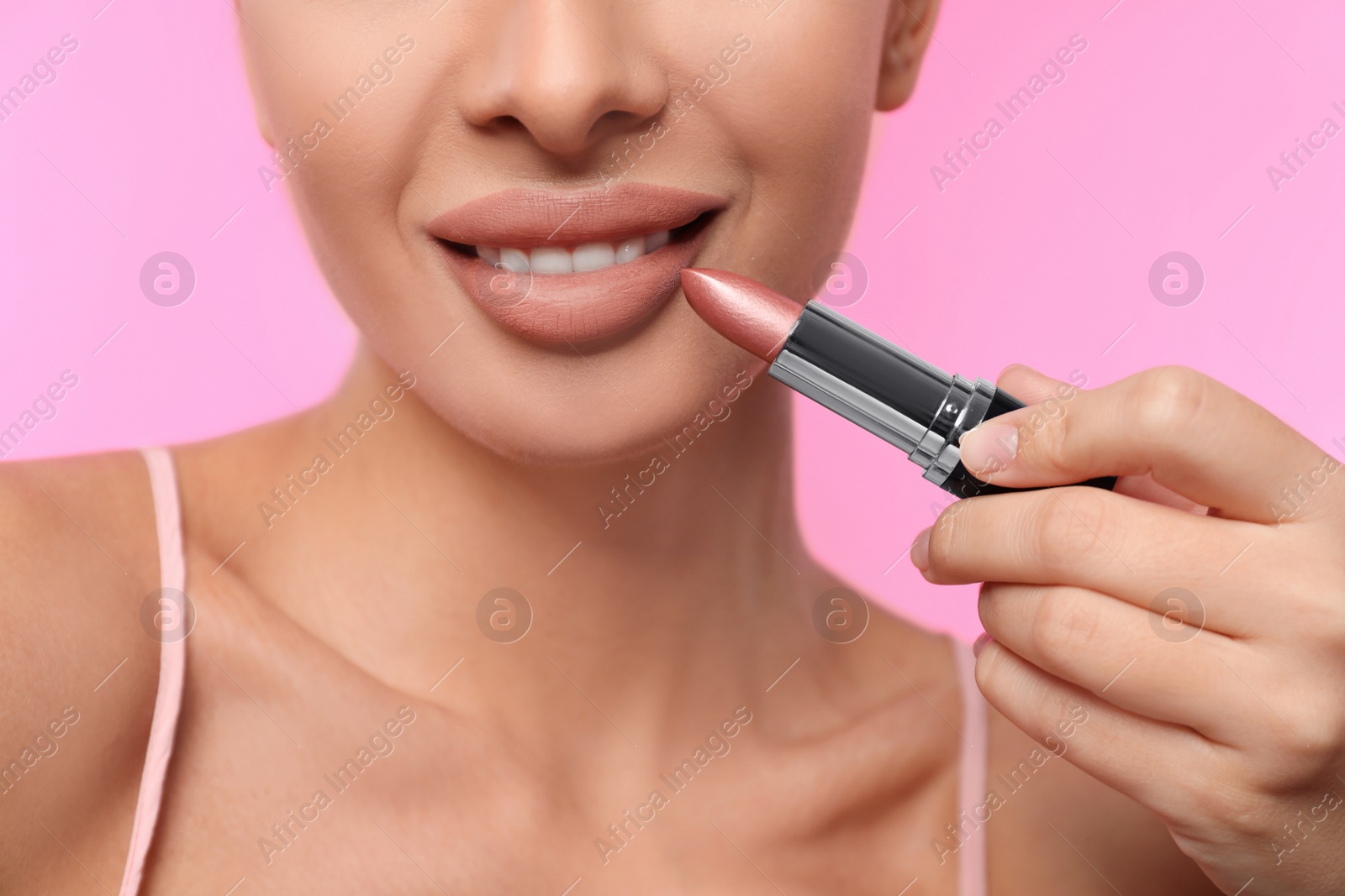 Photo of Woman with matte lipstick on pink background, closeup