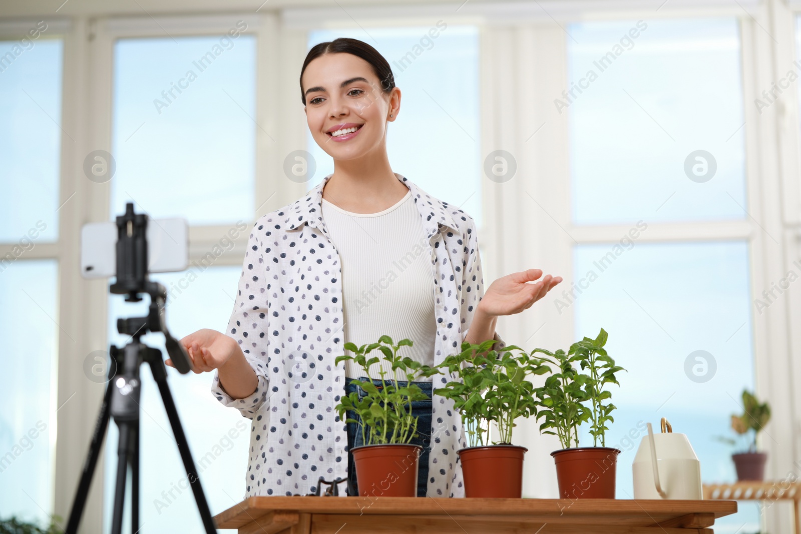 Photo of Teacher conducting online gardening course at home. Time for hobby