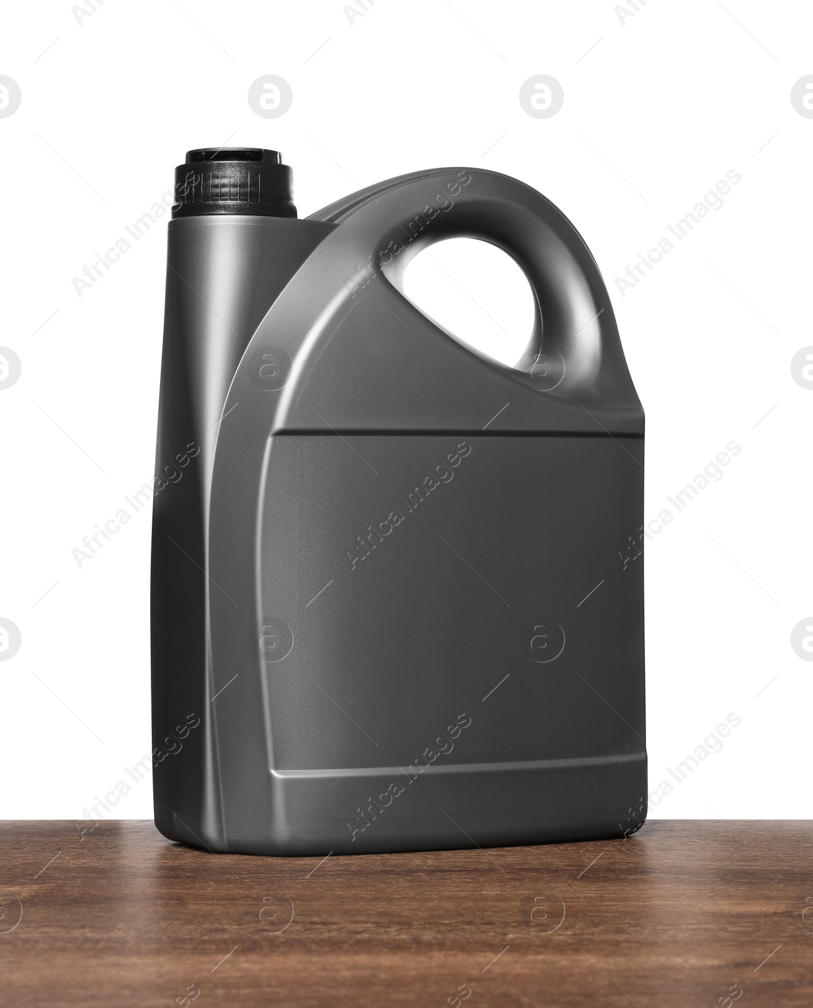 Photo of Motor oil in grey container on wooden table against white background