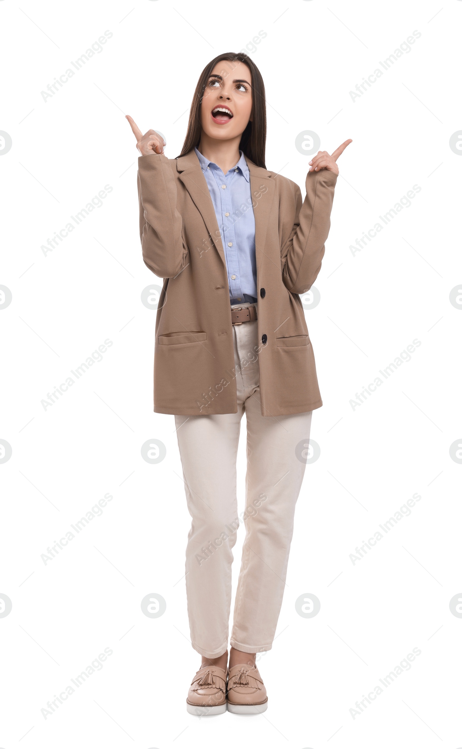 Photo of Beautiful businesswoman pointing at something on white background