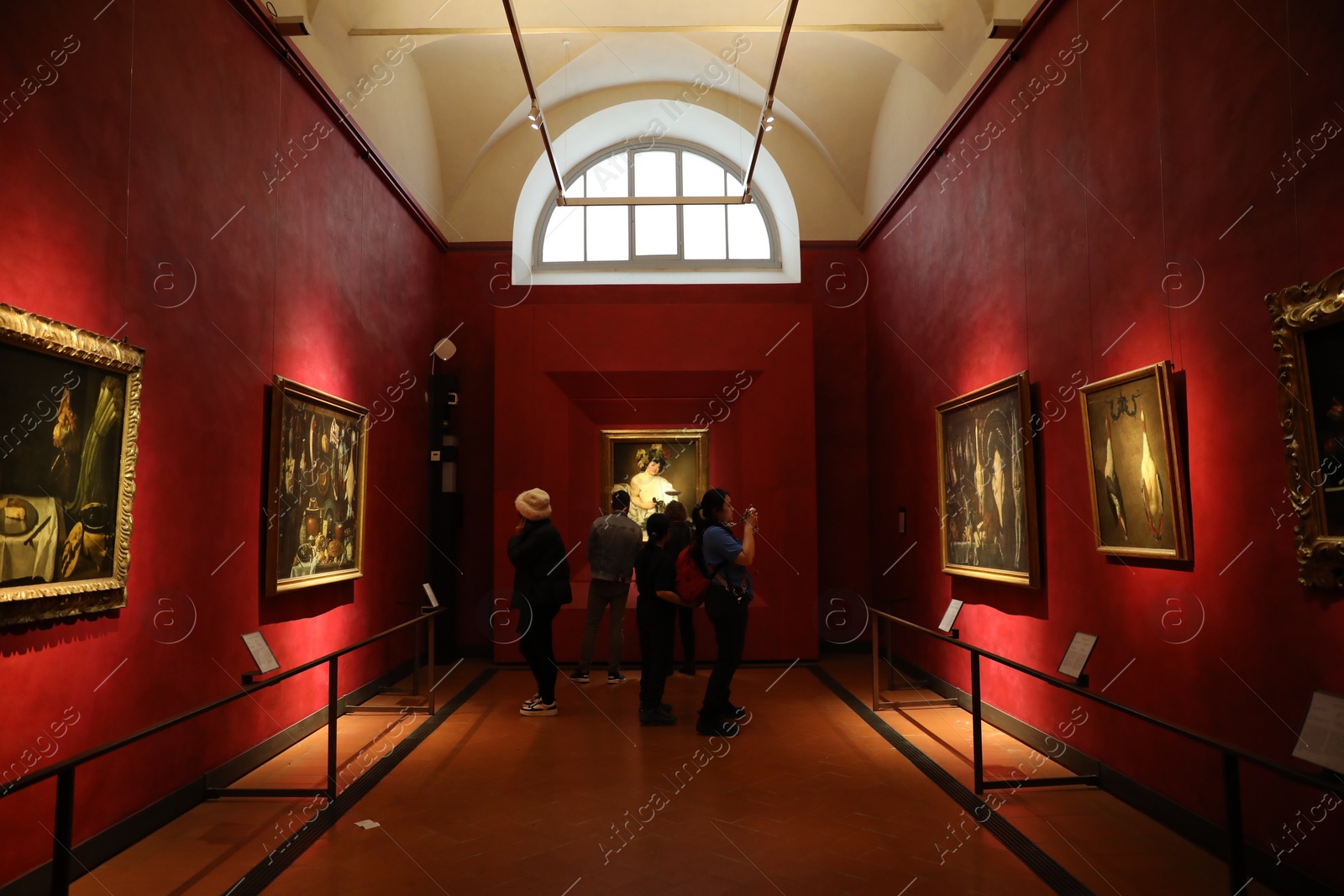 Photo of Florence, Italy - February 8, 2024: Visitors admiring different famous paintings at Uffizi gallery