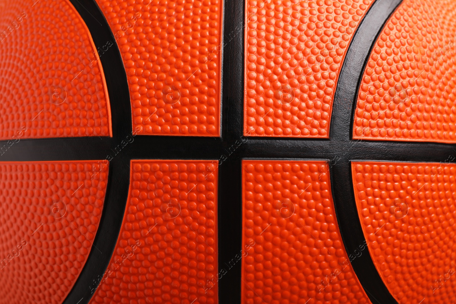 Photo of Orange basketball ball as background, closeup view