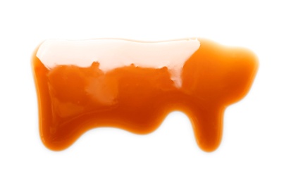 Photo of Delicious caramel sauce on white background