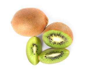 Cut and whole fresh kiwis on white background, top view