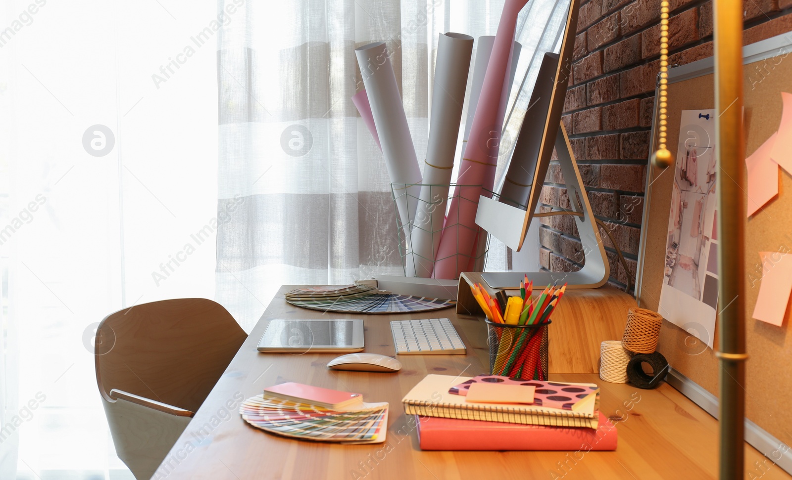 Photo of Office supplies and computer on wooden table. Designer's workplace