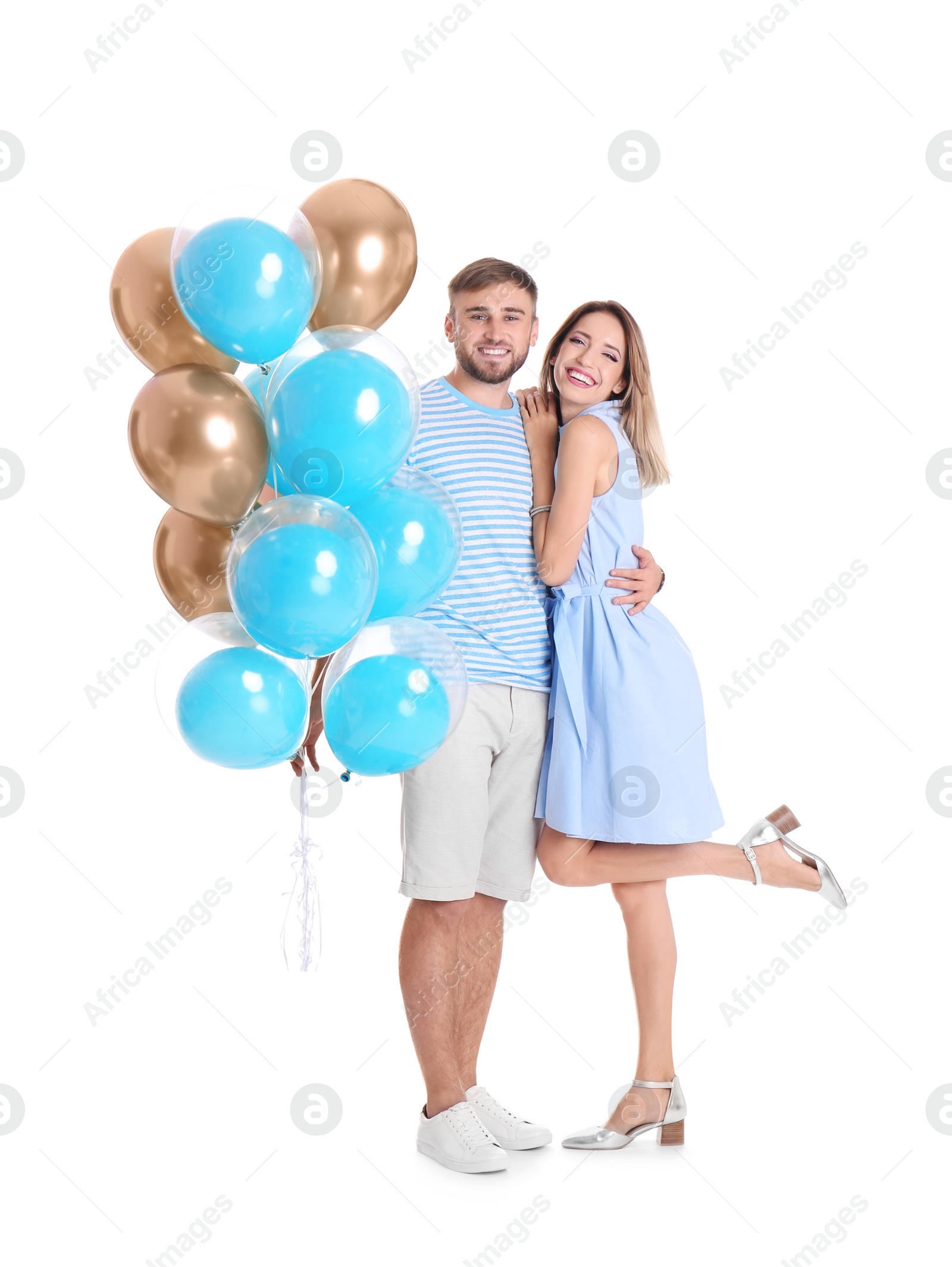 Photo of Young couple with air balloons on white background