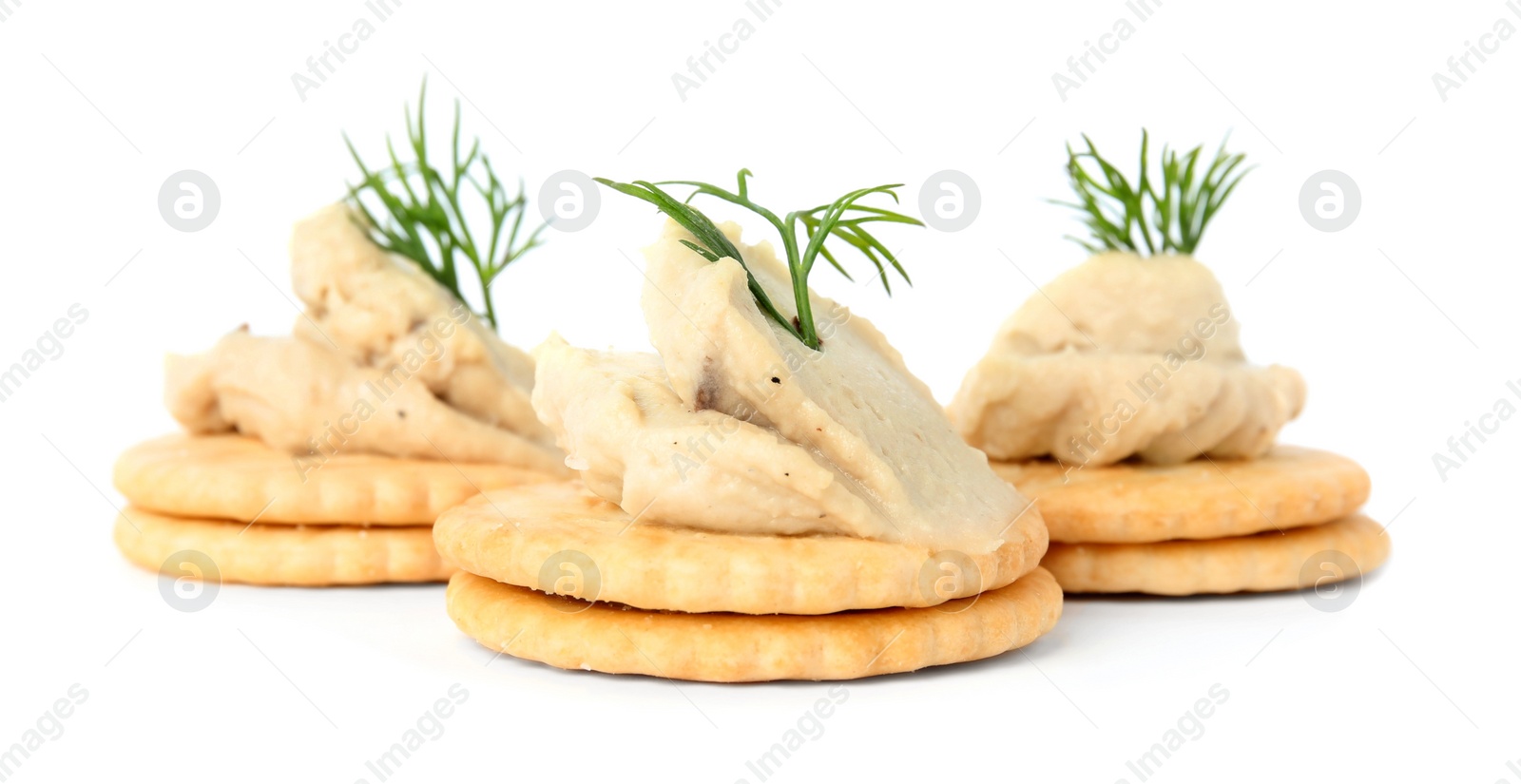 Photo of Delicious crackers with humus and dill on white background