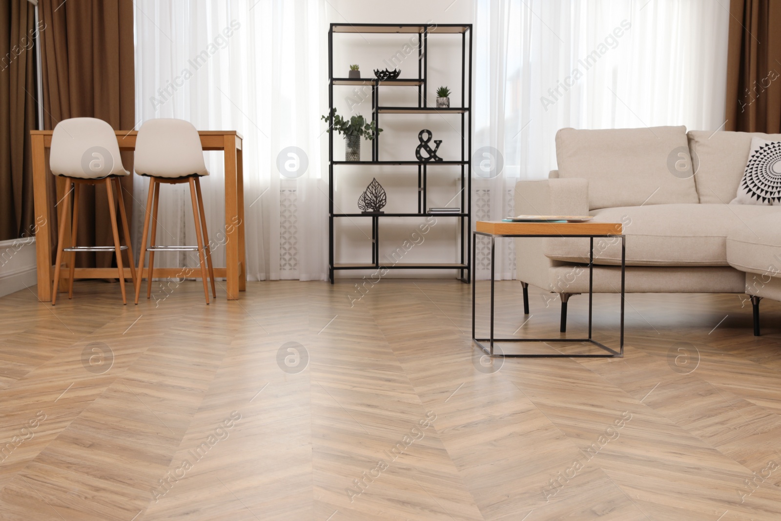 Photo of Modern living room with parquet flooring and stylish furniture