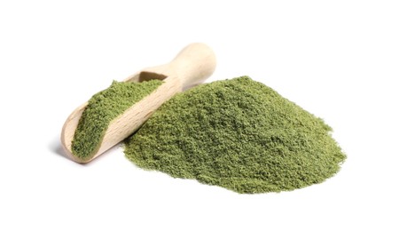 Photo of Pile of wheat grass powder and scoop isolated on white