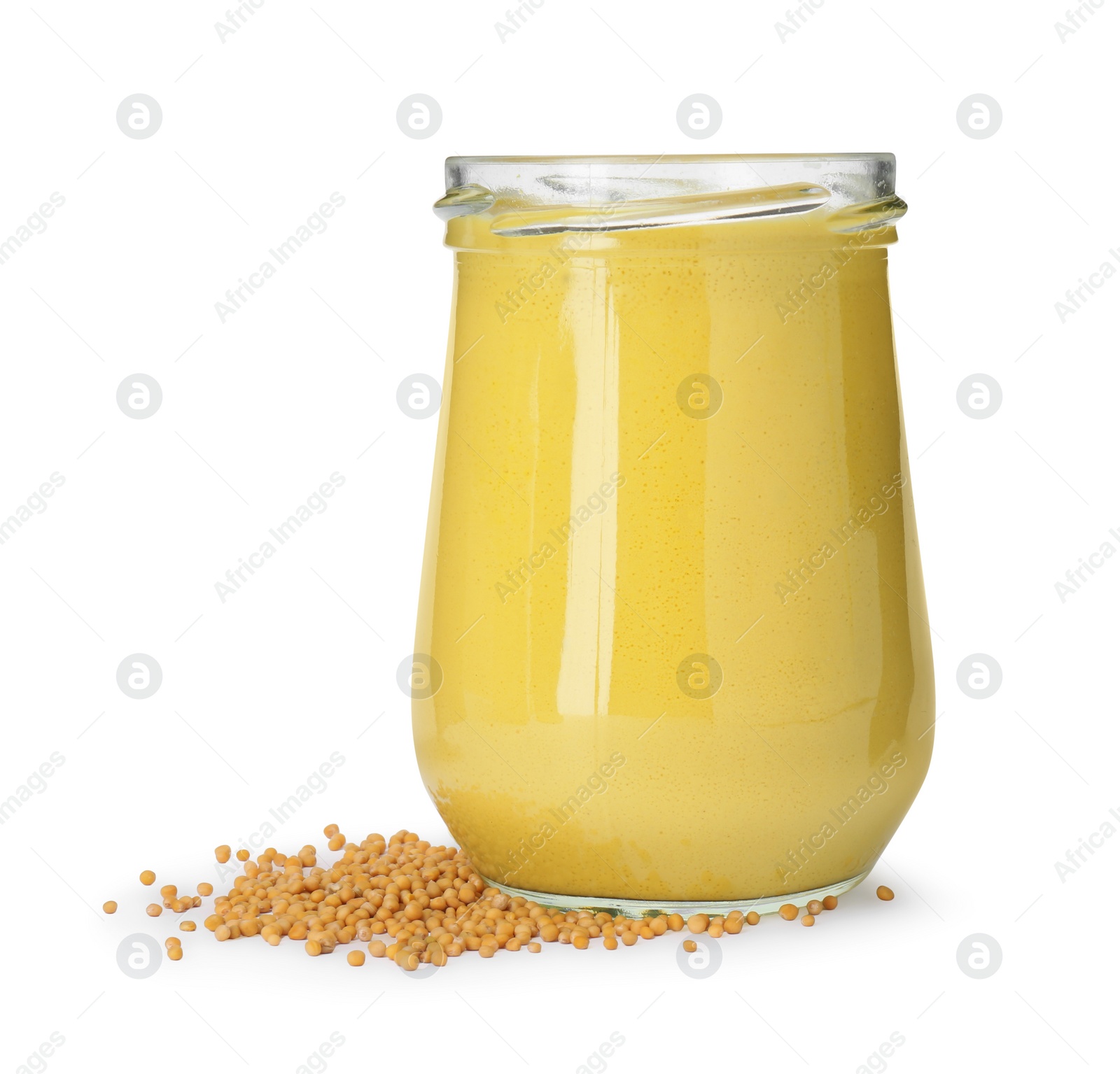 Photo of Glass jar of tasty mustard sauce and dry seeds isolated on white