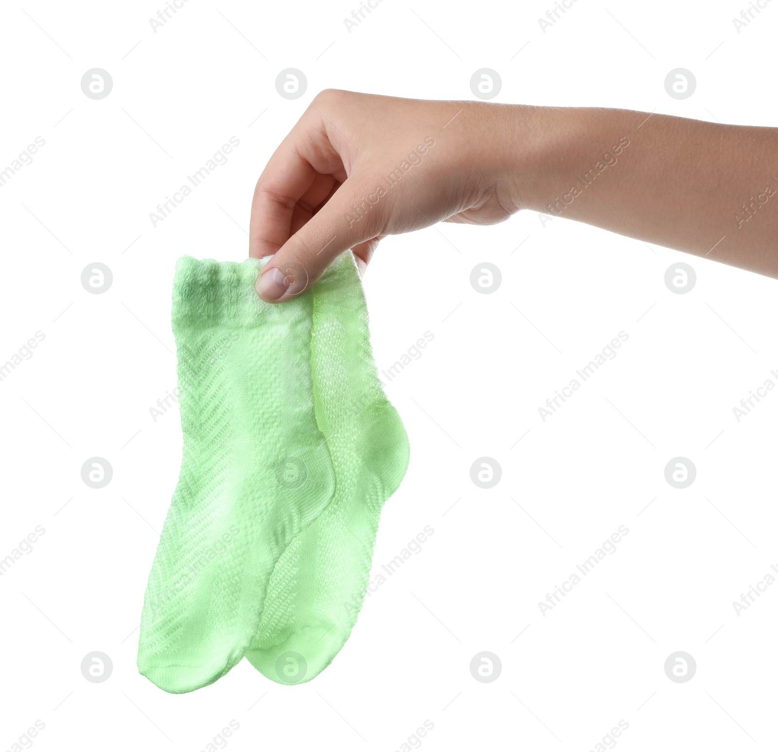 Photo of Woman holding pair of cute child socks on white background, closeup