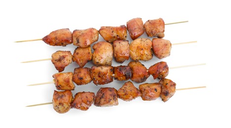 Photo of Delicious shish kebabs isolated on white, top view