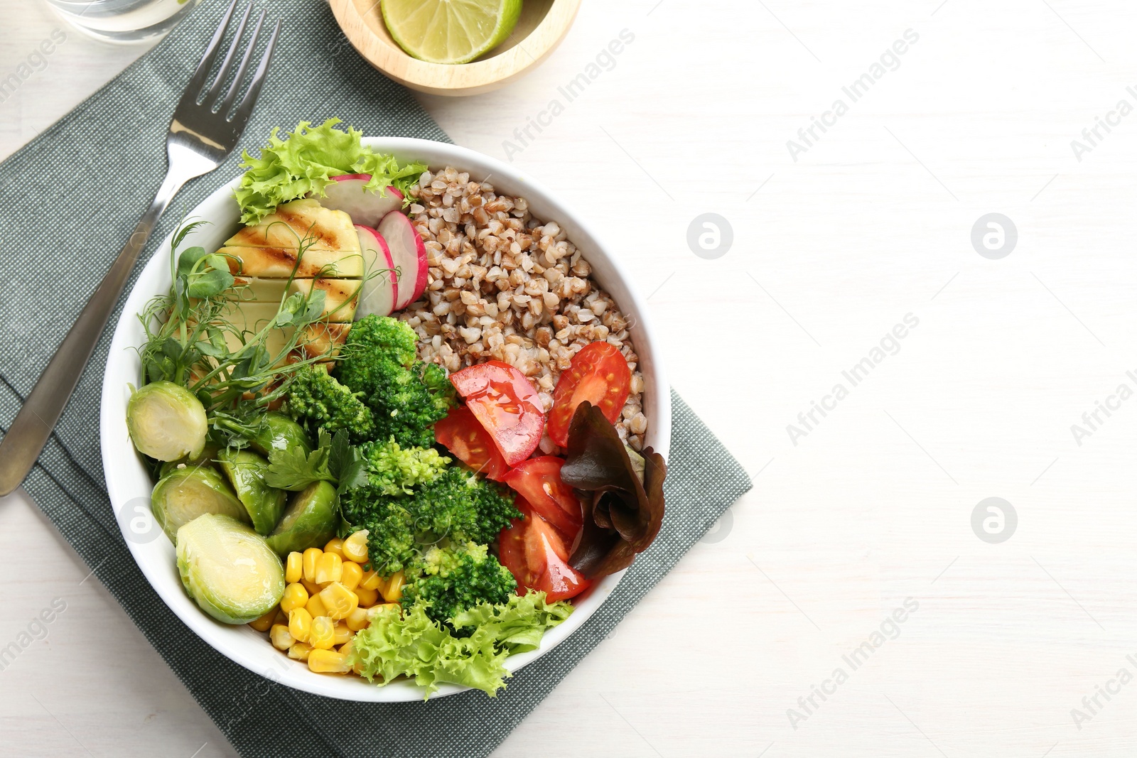 Photo of Healthy meal. Tasty products in bowl on white table, top view. Space for text