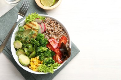 Healthy meal. Tasty products in bowl on white table, top view. Space for text