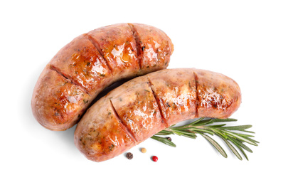 Grilled sausages and rosemary on white background, top view