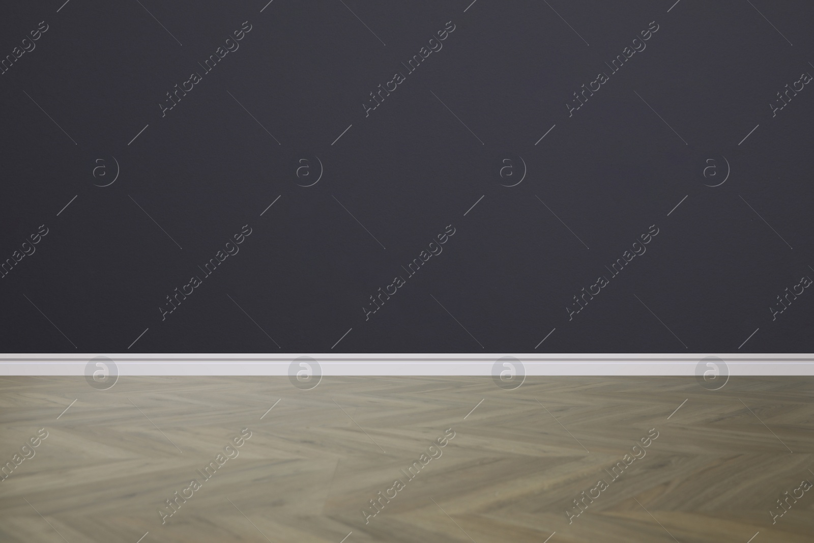 Image of Wooden floor and empty dark wall indoors