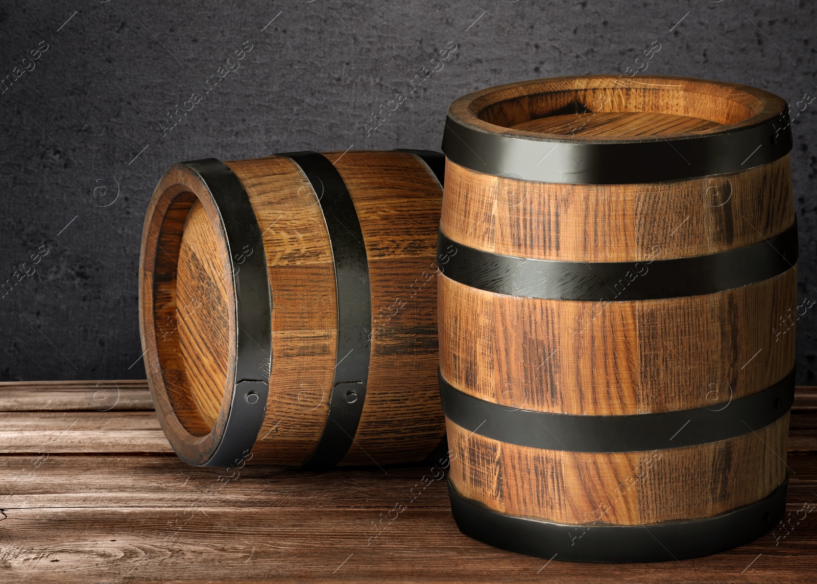 Image of Wooden barrels against grey background, space for text