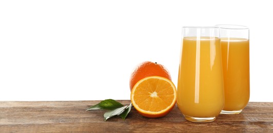 Delicious orange juice and fresh fruits on wooden table against white background