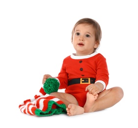 Photo of Cute little baby wearing festive Christmas costume on white background