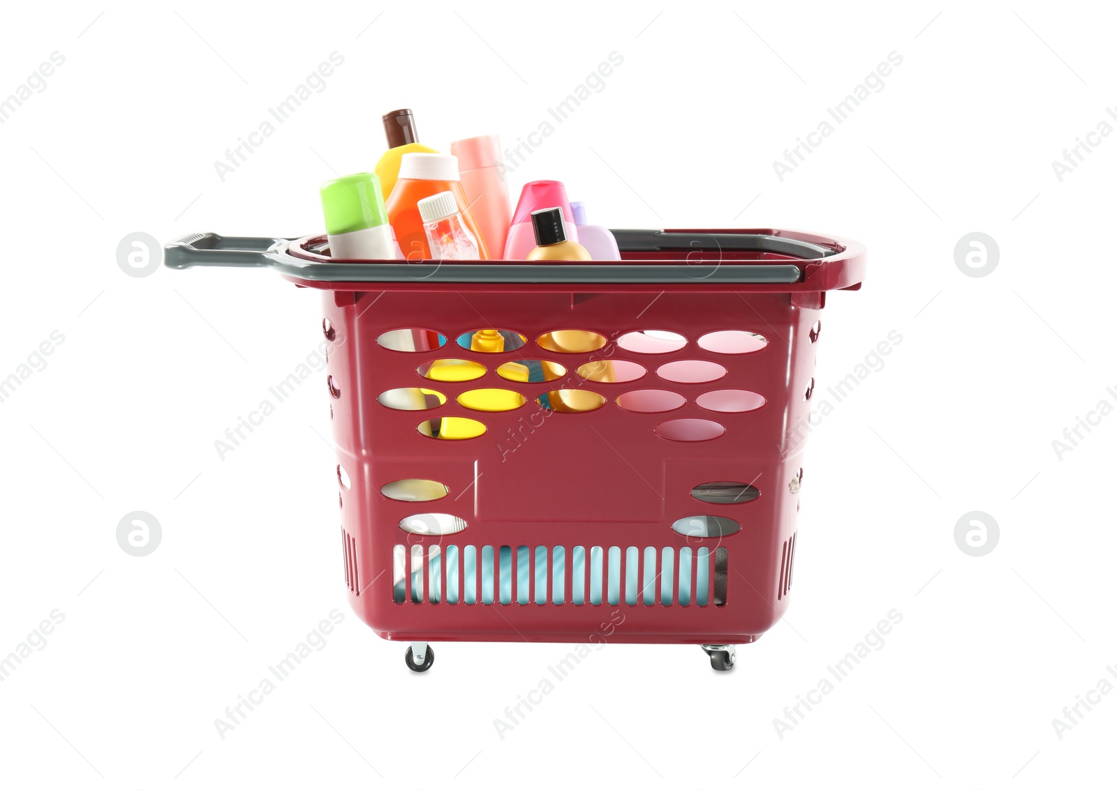 Photo of Shopping basket full of cleaning supplies isolated on white