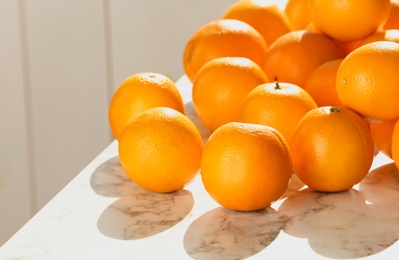 Photo of Fresh juicy oranges on table, space for text. Healthy fruits