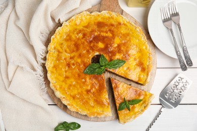 Delicious pie with minced meat on white wooden table, flat lay