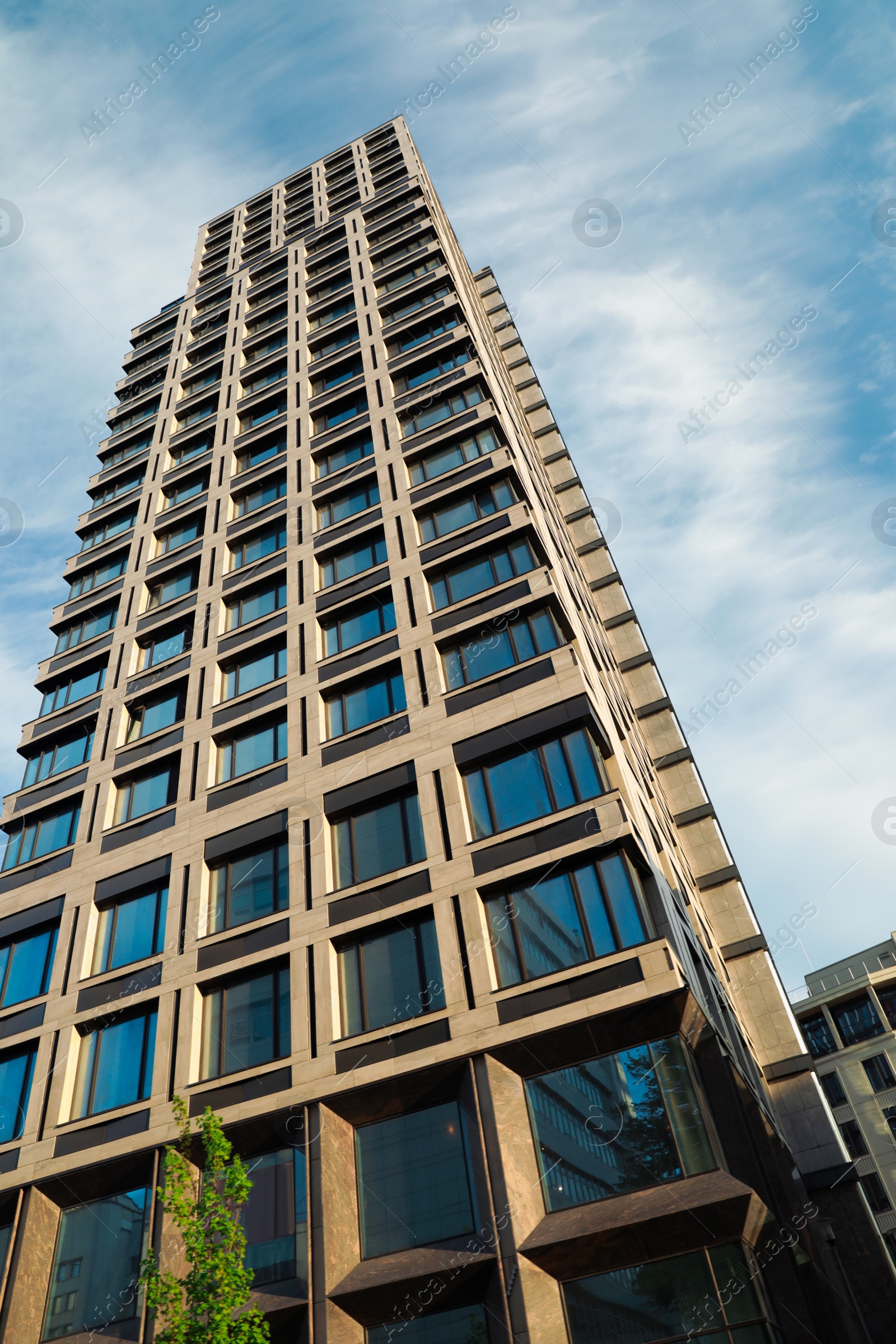 Photo of Beautiful modern building on sunny day, low angle view