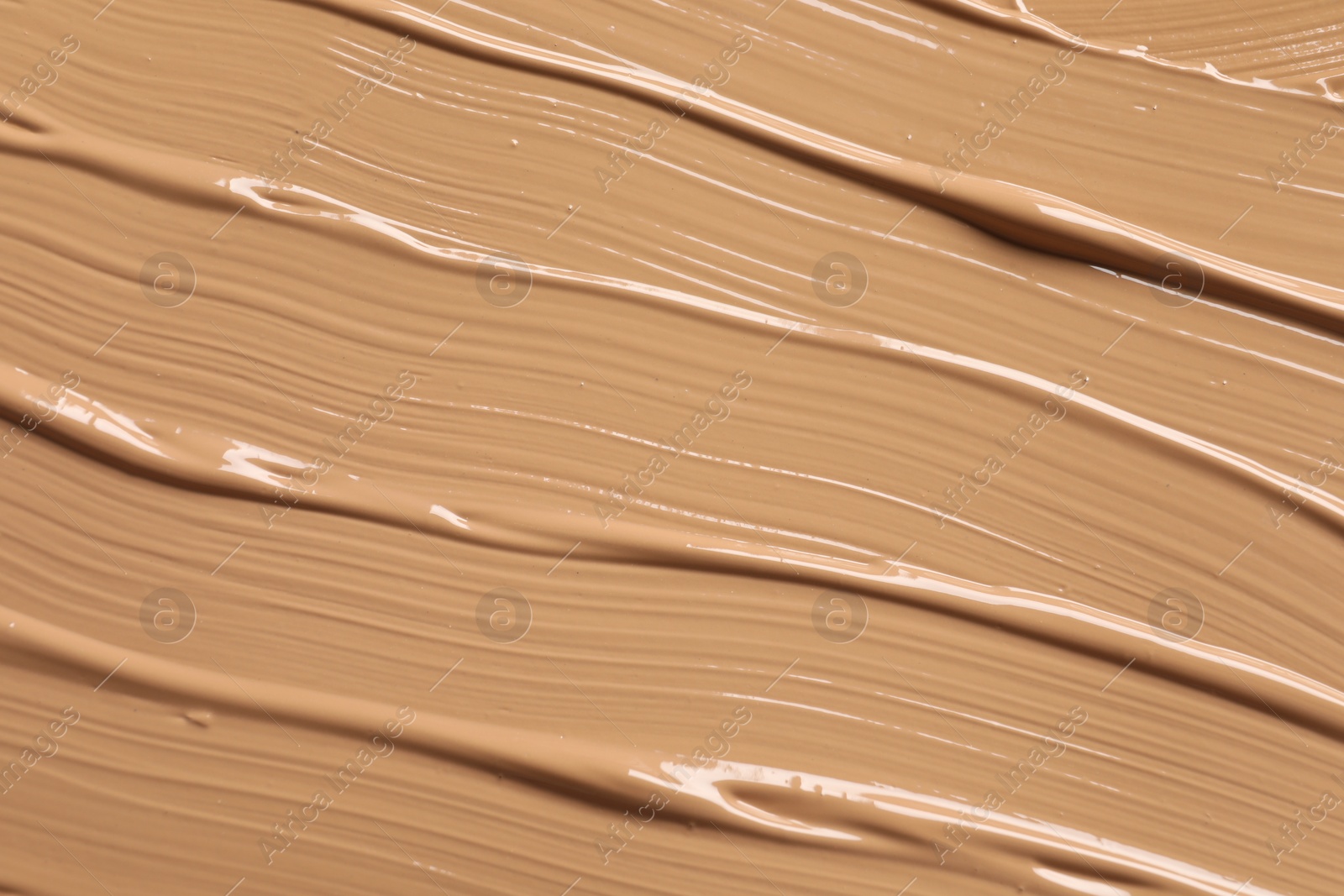 Photo of Texture of skin foundation as background, closeup