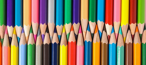 Photo of Different color pencils as background, top view