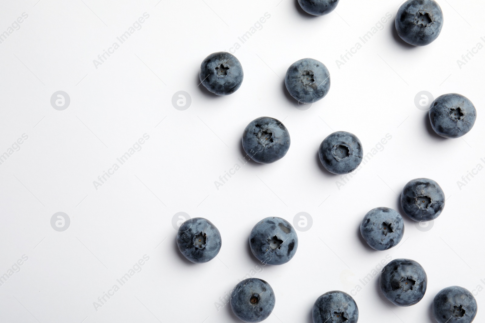 Photo of Flat lay composition with tasty blueberry and space for text on white background