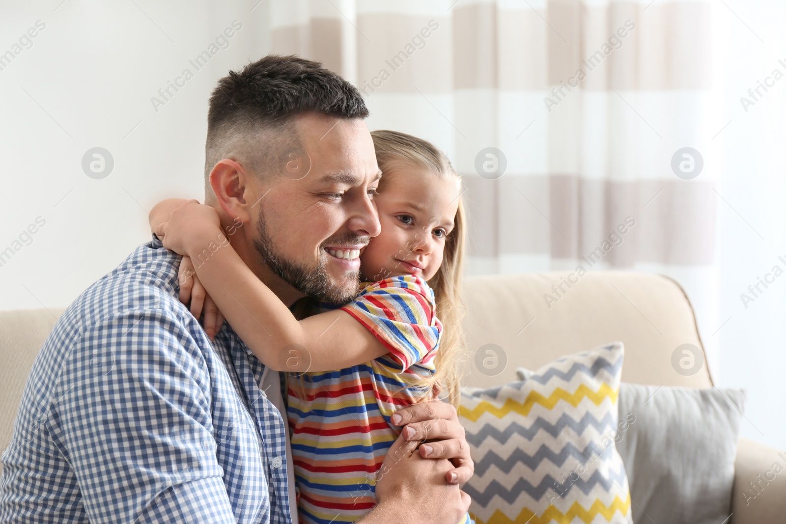 Photo of Dad and daughter spending time together at home. Happy Father's Day