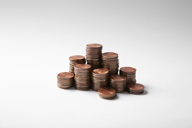 Photo of Many stacks of American coins on white background