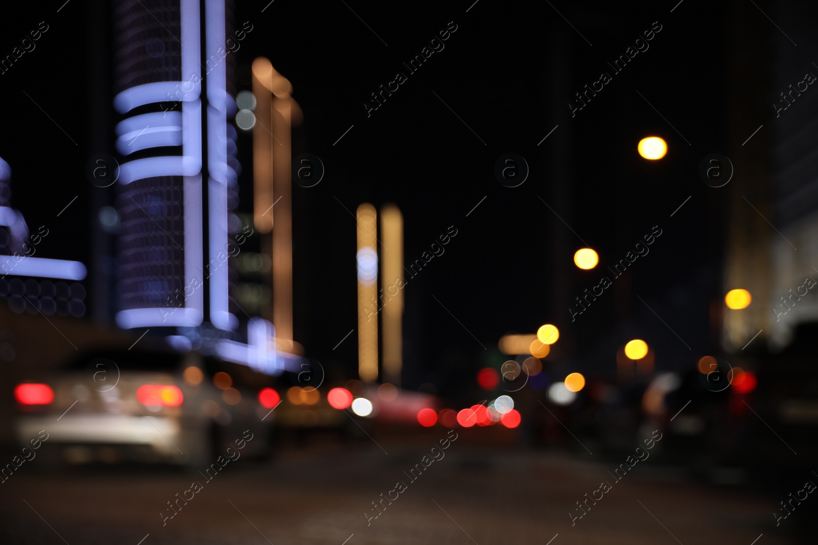 Photo of Blurred view of cityscape with bokeh effect. Night life