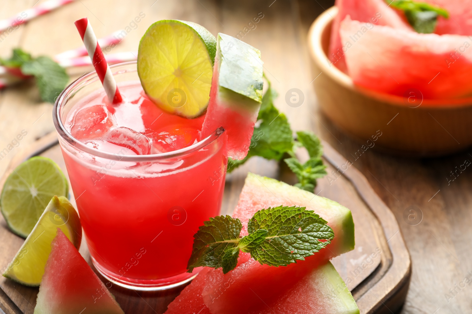 Photo of Delicious fresh watermelon drink on wooden table, closeup