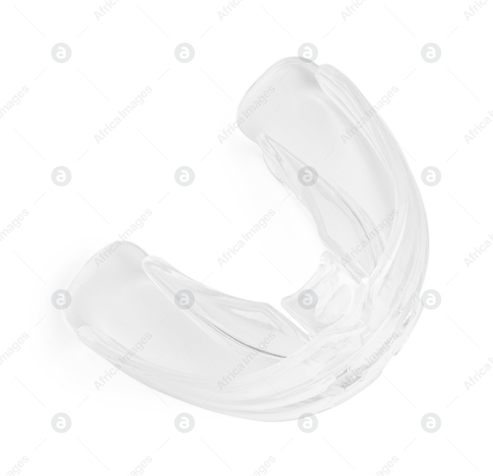 Photo of Transparent dental mouth guard isolated on white, top view. Bite correction