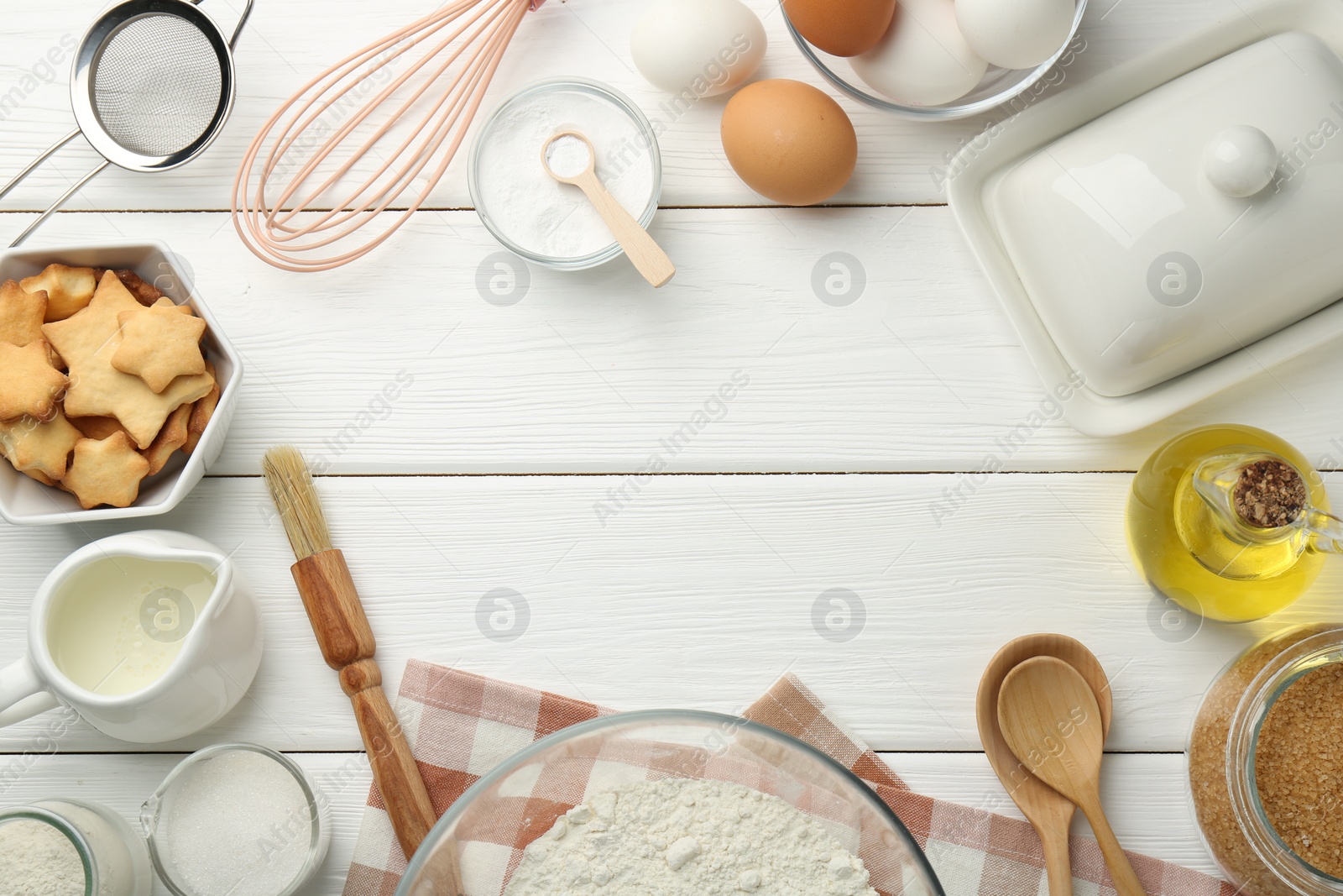 Photo of Frame of many different products on white wooden table, flat lay. Space for text