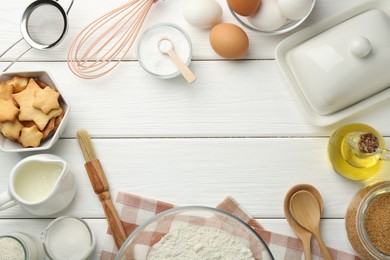 Photo of Frame of many different products on white wooden table, flat lay. Space for text