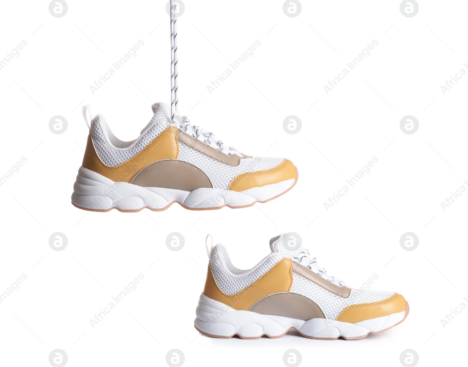 Photo of Pair of sports shoes on white background