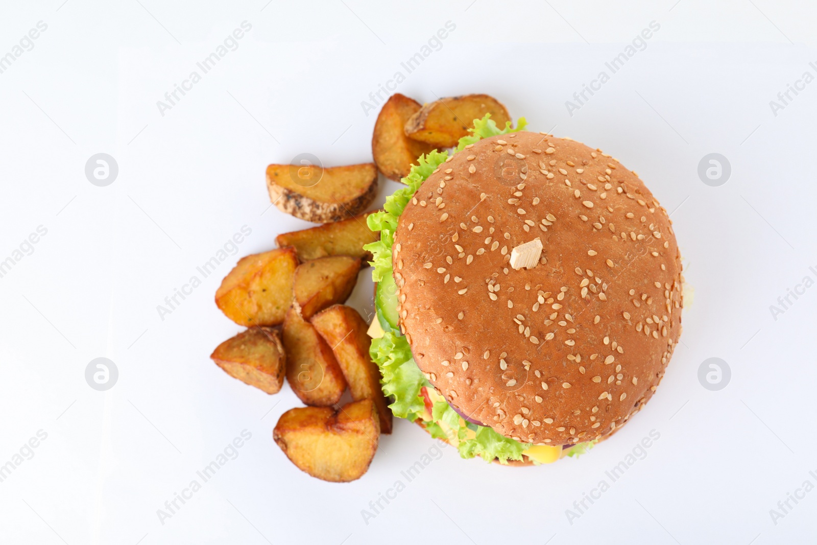 Photo of Fresh burger with fried potatoes on white background, top view