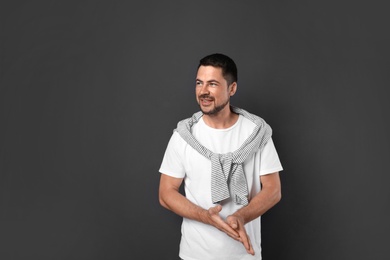 Photo of Portrait of handsome man on dark background