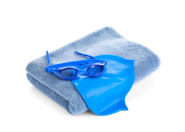 Photo of Swimming cap, goggles and towel isolated on white
