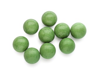 Photo of Bright green chewy gumballs isolated on white