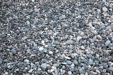 Photo of Surface covered with many different pebbles as background