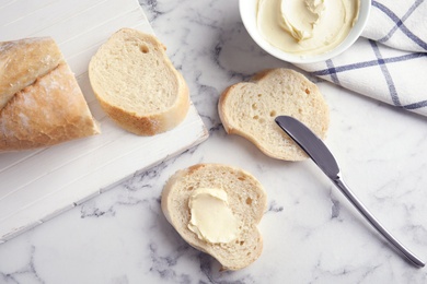 Photo of Flat lay composition with bread for breakfast on marble table