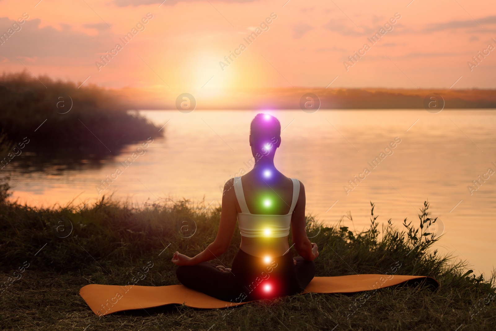 Image of Woman meditating near river in twilight, back view. Scheme of seven chakras, illustration