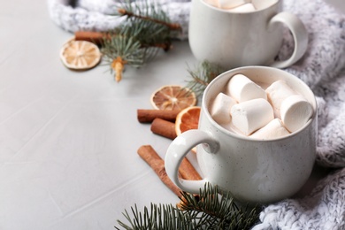 Photo of Composition with hot cocoa drink on grey background