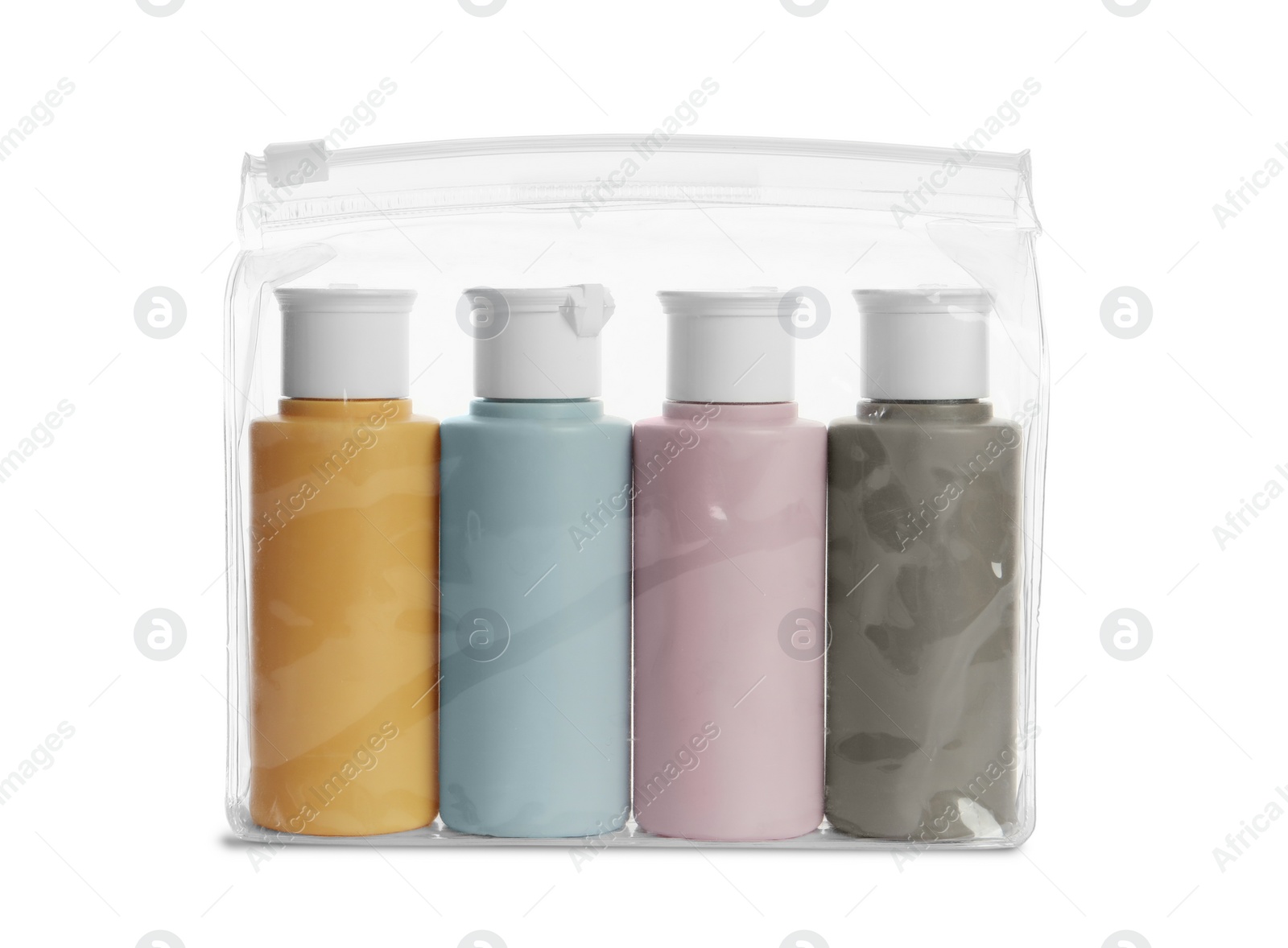 Photo of Cosmetic travel kit in plastic bag isolated on white