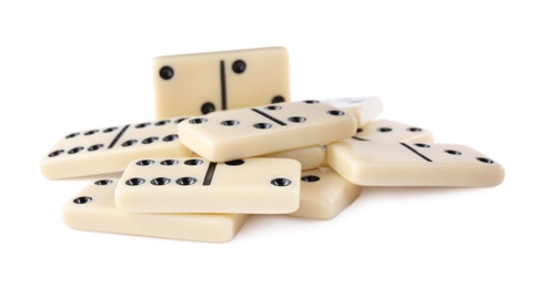 Photo of Pile of classic domino tiles on white background