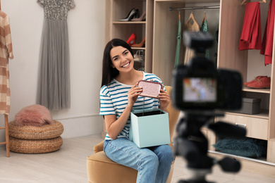 Photo of Fashion blogger recording new video in room